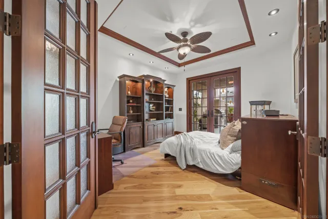 a living room with furniture a potted plant and a rug