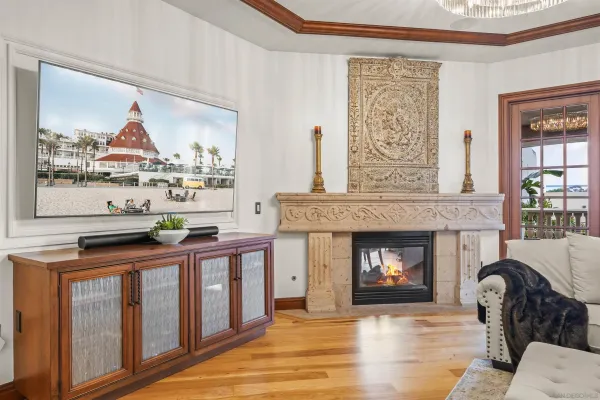 a living room with furniture and kitchen