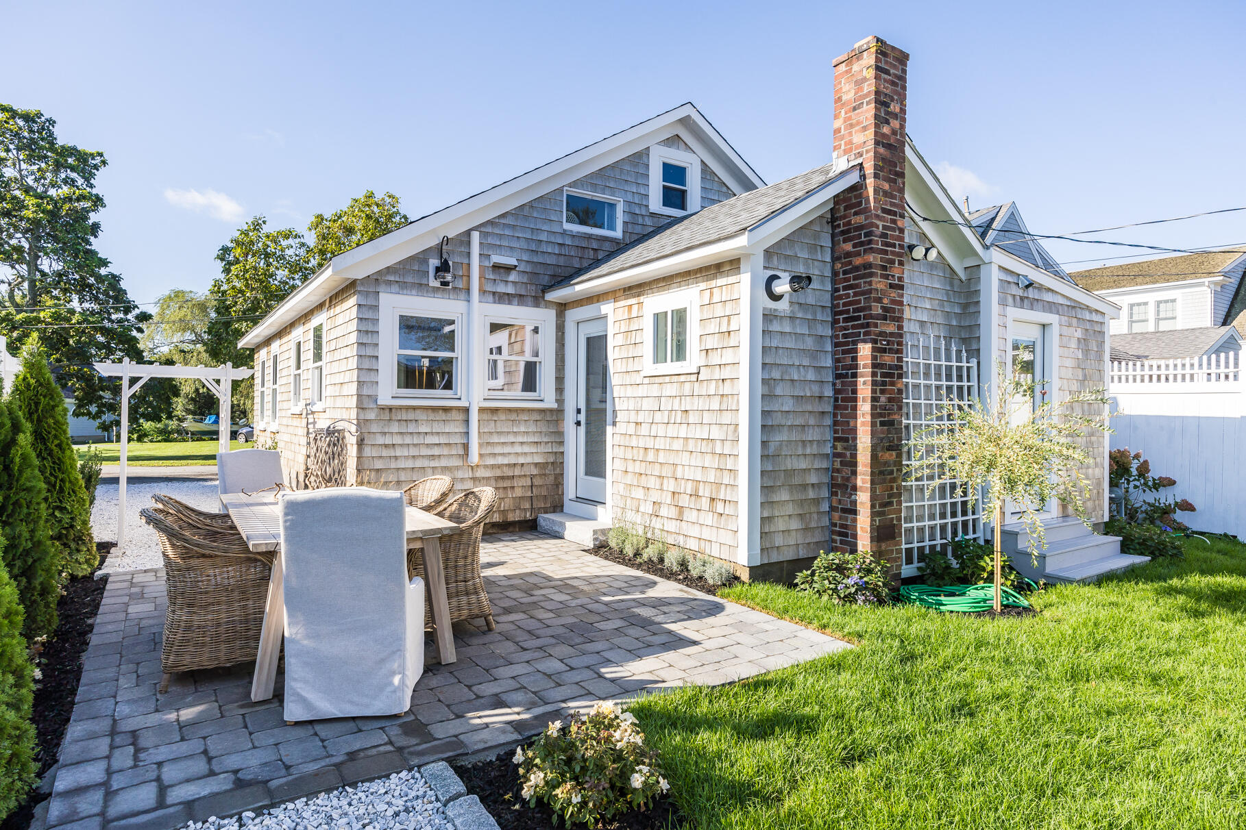 38 Sunset Lane Osterville, MA 02655 - Photo 29 of 39 a view of a house with backyard sitting area and garden