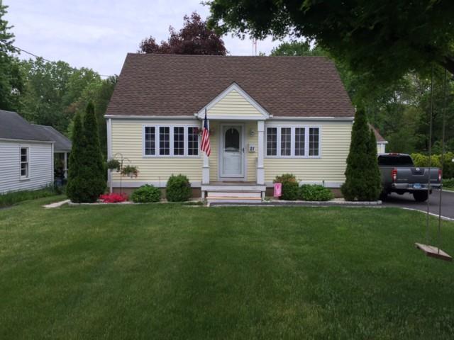 21 Eagle Road Norwalk, CT 06850 - Photo 1 of 1 a front view of a house with a yard and trees