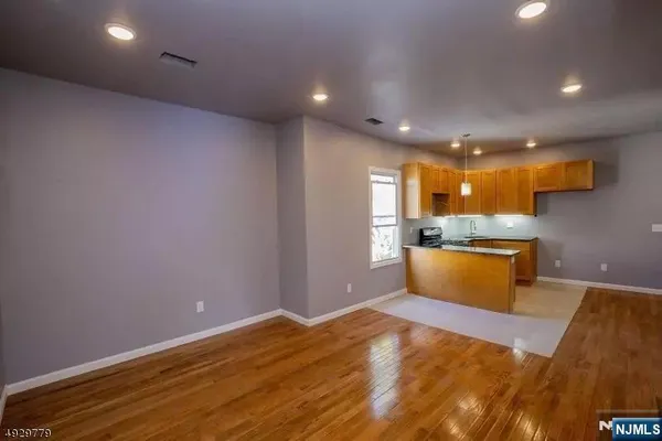 a view of kitchen and wooden floor
