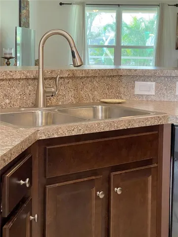 a view of living room with granite countertop furniture and fireplace