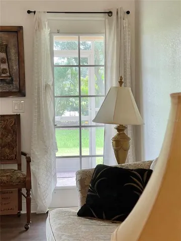 a spacious bathroom with a tub and a mirror