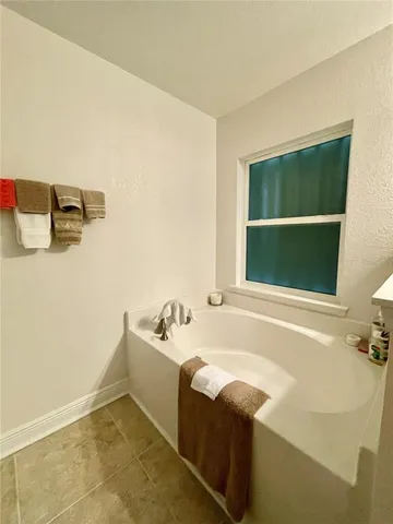 a spacious bathroom with a double vanity sink mirror and double