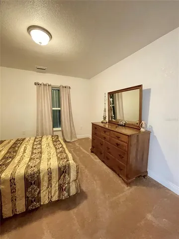 a view of a backyard with a garden