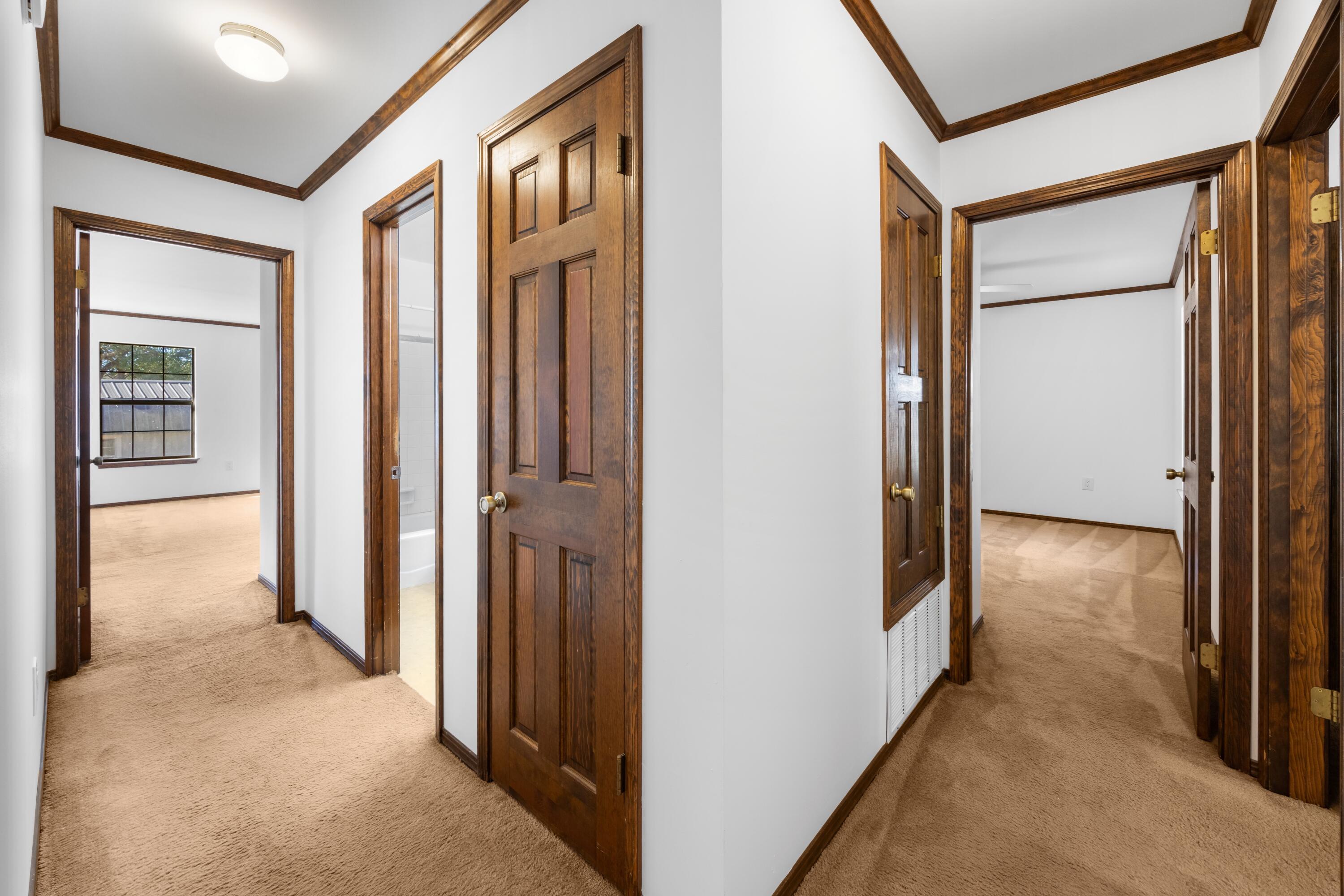 3066 Craig Terrace Crestview, FL 32539 - Photo 17 of 43 a view of a hallway with closet and wooden floor