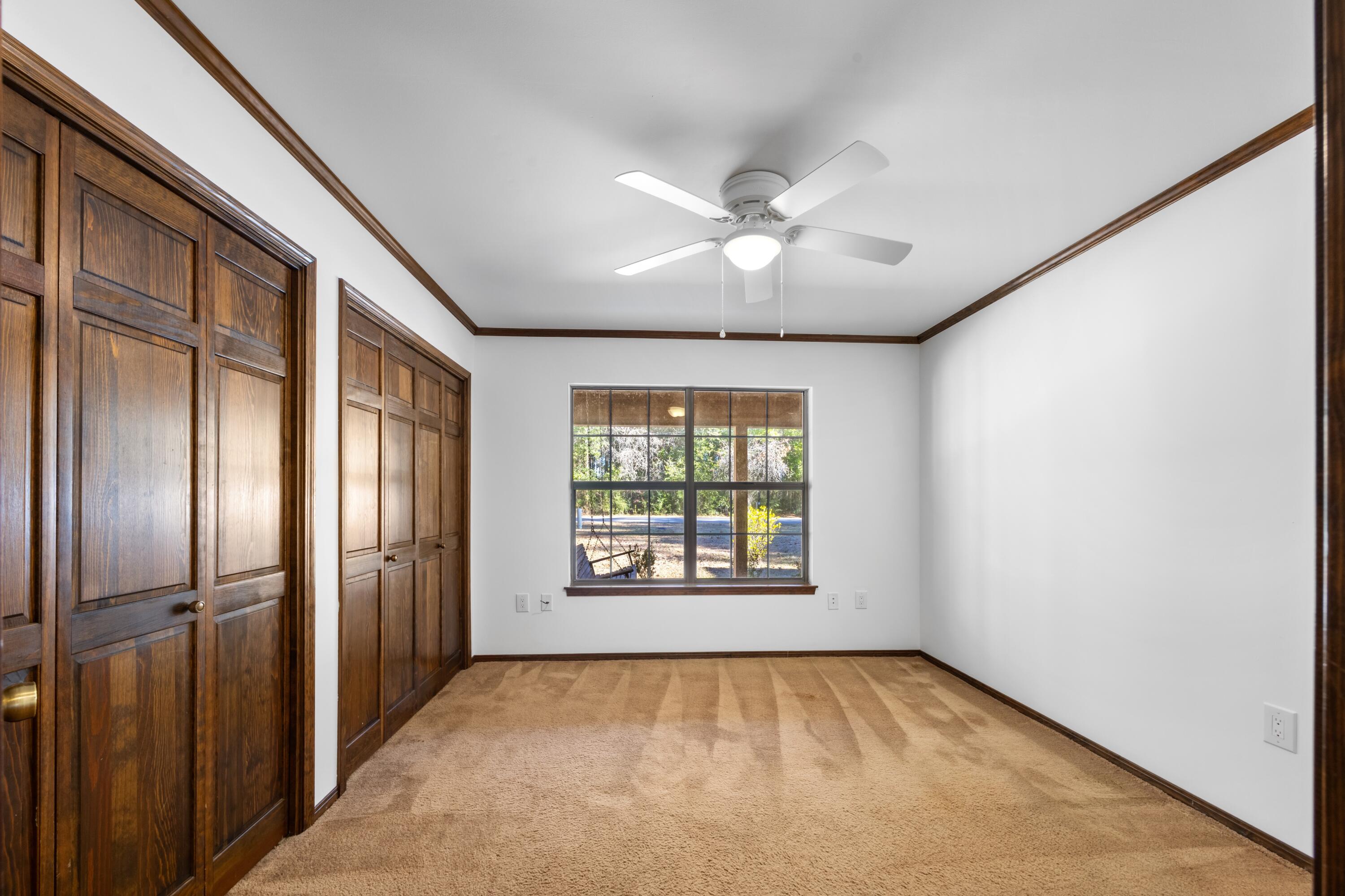 3066 Craig Terrace Crestview, FL 32539 - Photo 18 of 43 an empty room with windows and closet