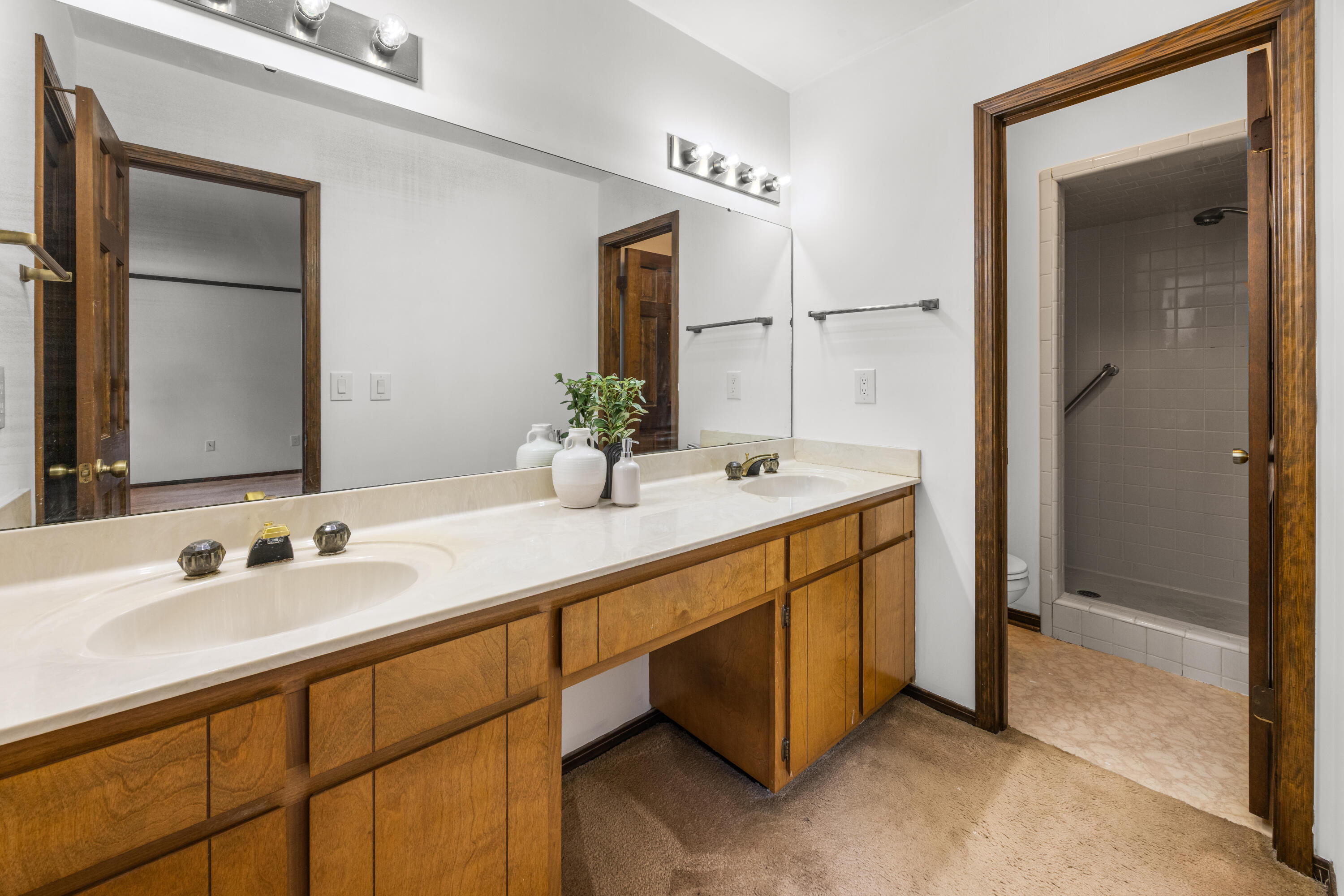 3066 Craig Terrace Crestview, FL 32539 - Photo 23 of 43 a bathroom with a double vanity sink and a mirror