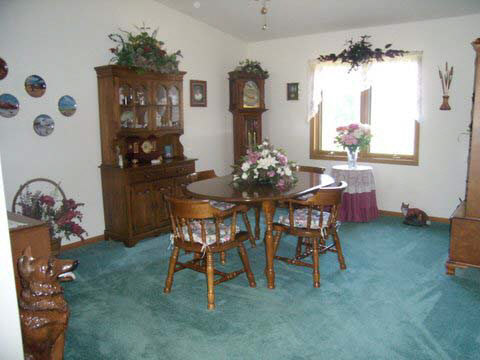 7239 Garden Prairie Road Garden Prairie, IL 61038 - Photo 5 of 11 a dining room with furniture and window