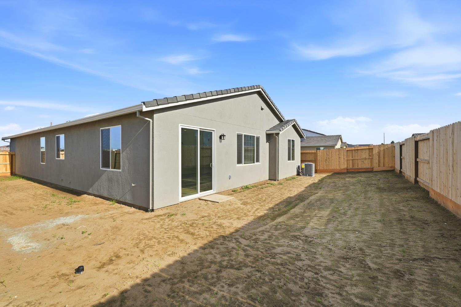 2244 Controllata Street Manteca, CA 95337 - Photo 10 of 11 a front view of a house with a yard