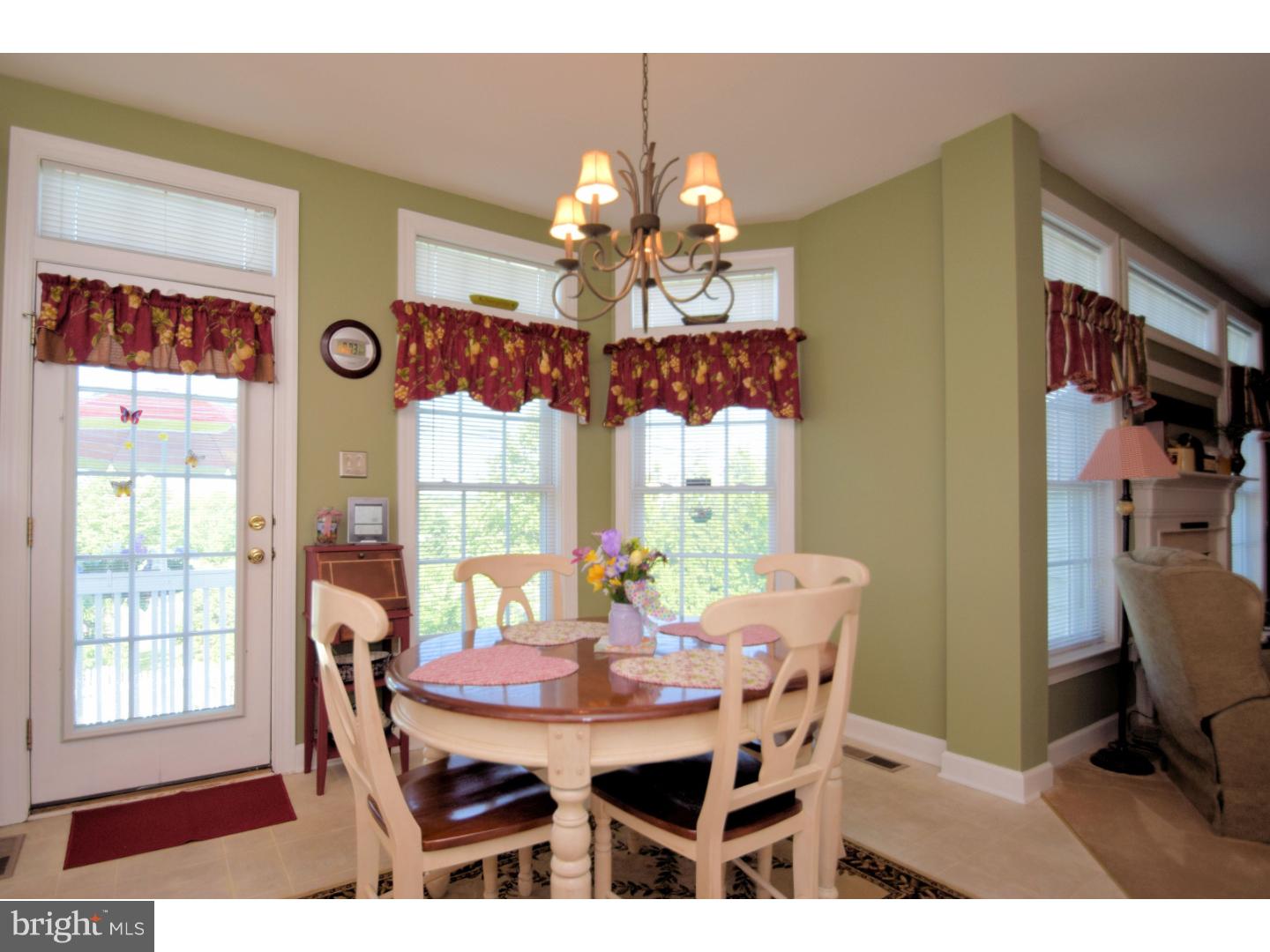 205 Barnhill Road Perkasie, PA 18944 - Photo 11 of 25 a view of a dining room with furniture and chandelier