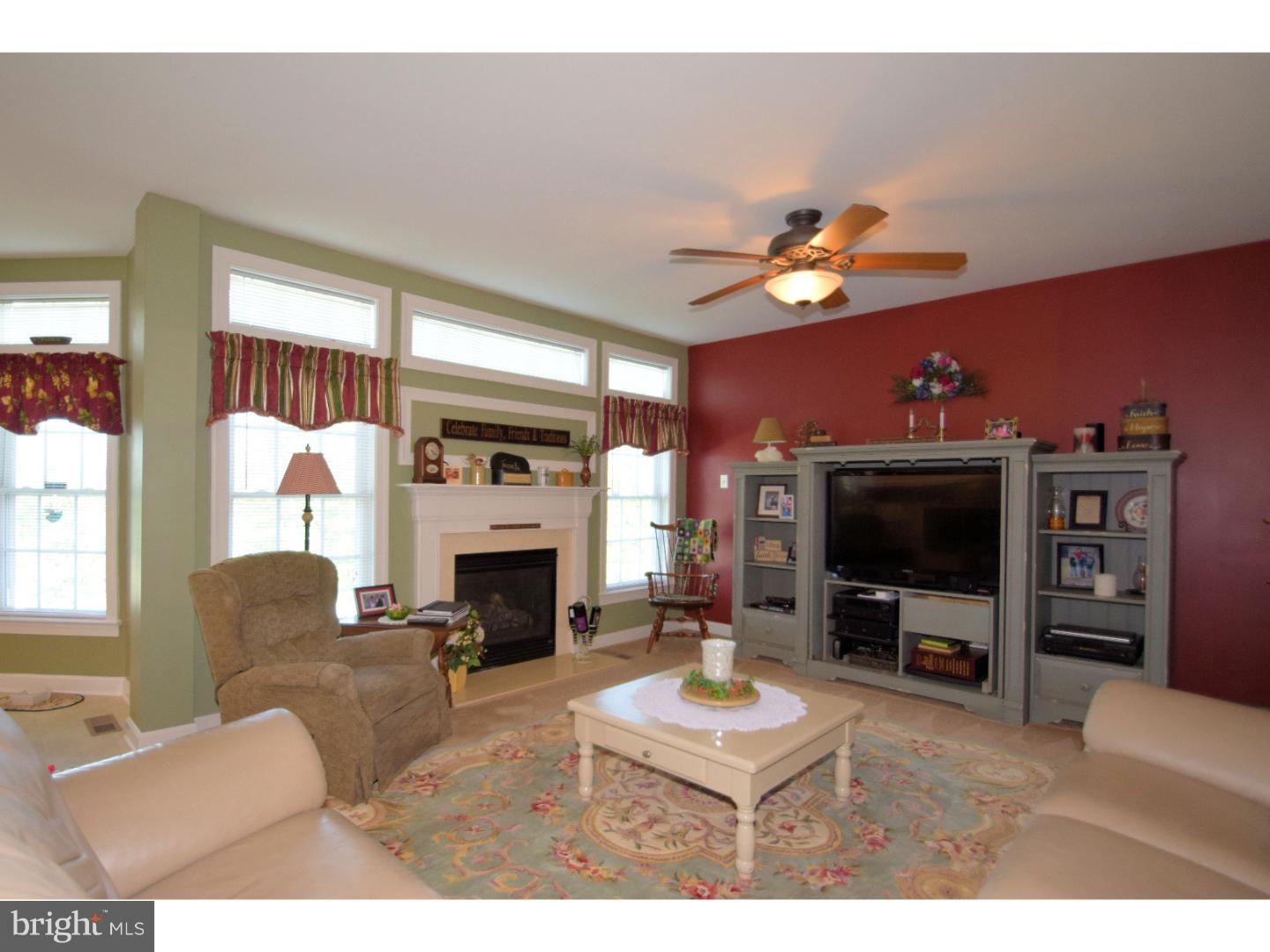 205 Barnhill Road Perkasie, PA 18944 - Photo 13 of 25 a living room with furniture a fireplace and a flat screen tv