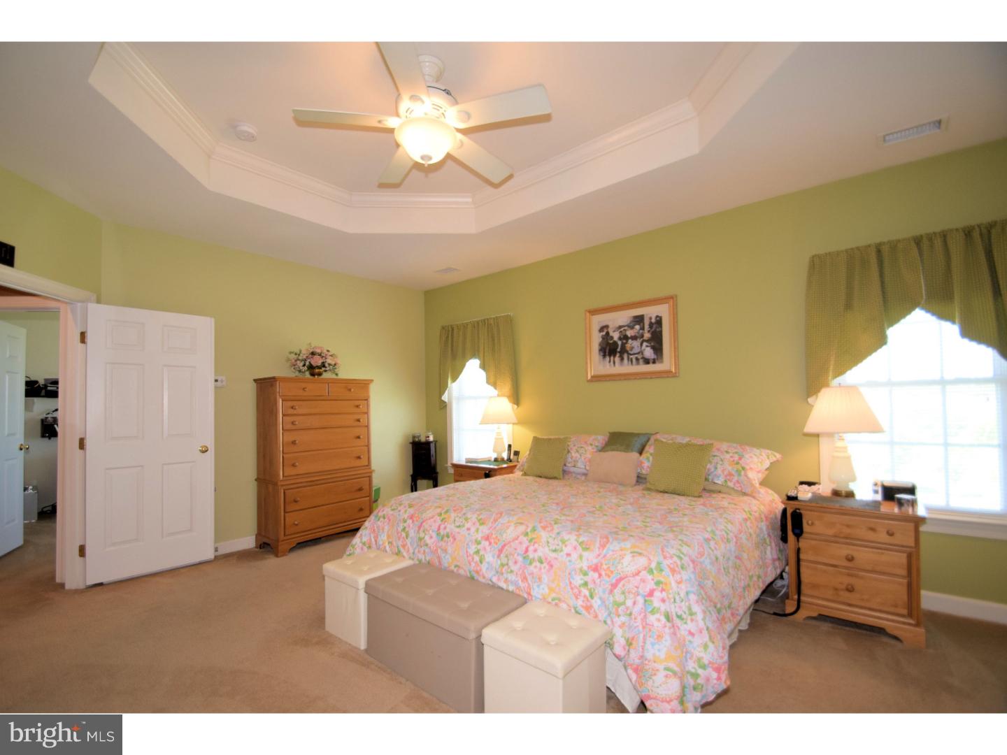 205 Barnhill Road Perkasie, PA 18944 - Photo 15 of 25 a bedroom with a bed and a chandelier