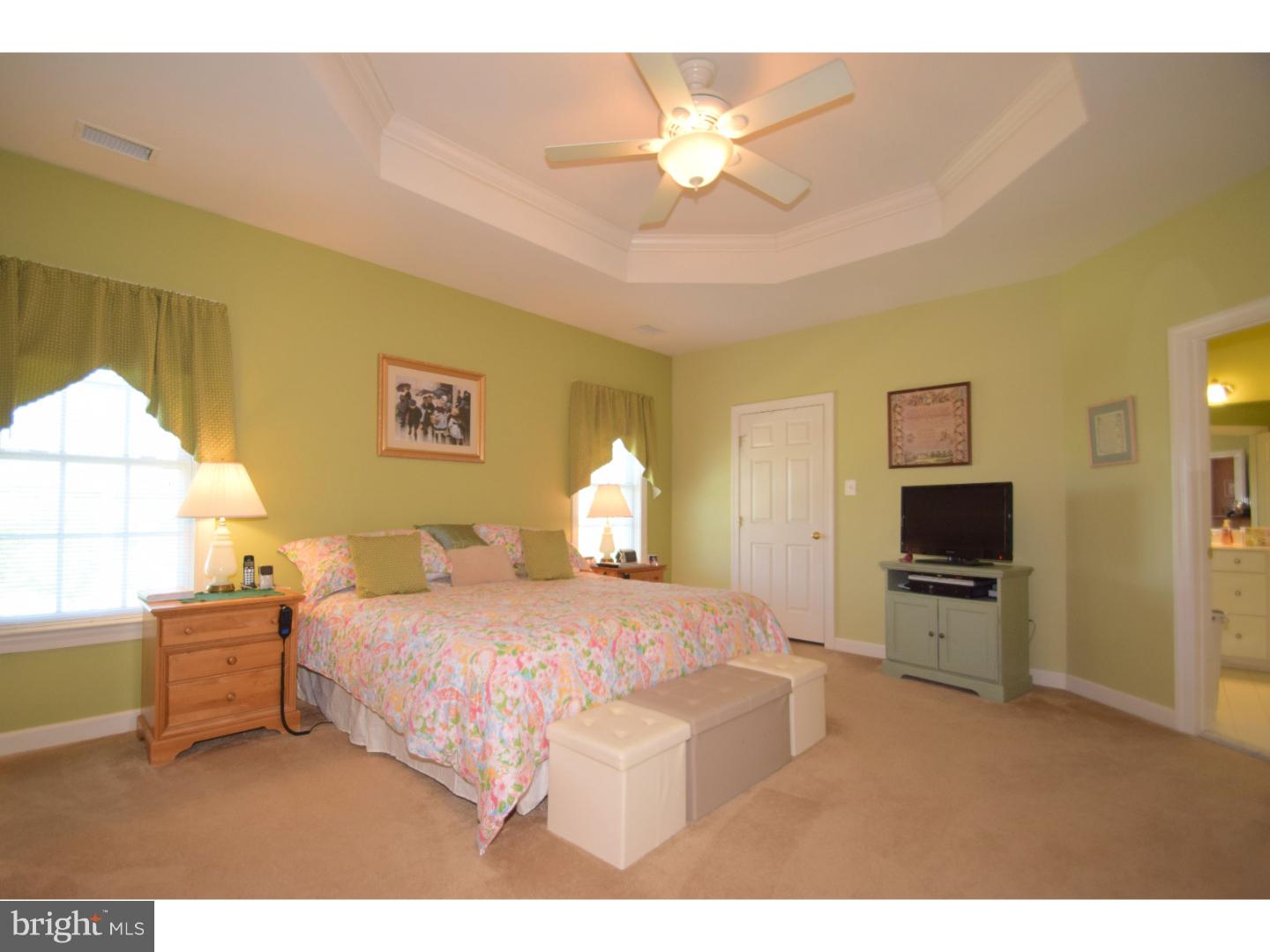 205 Barnhill Road Perkasie, PA 18944 - Photo 16 of 25 a bedroom with a bed and a chandelier