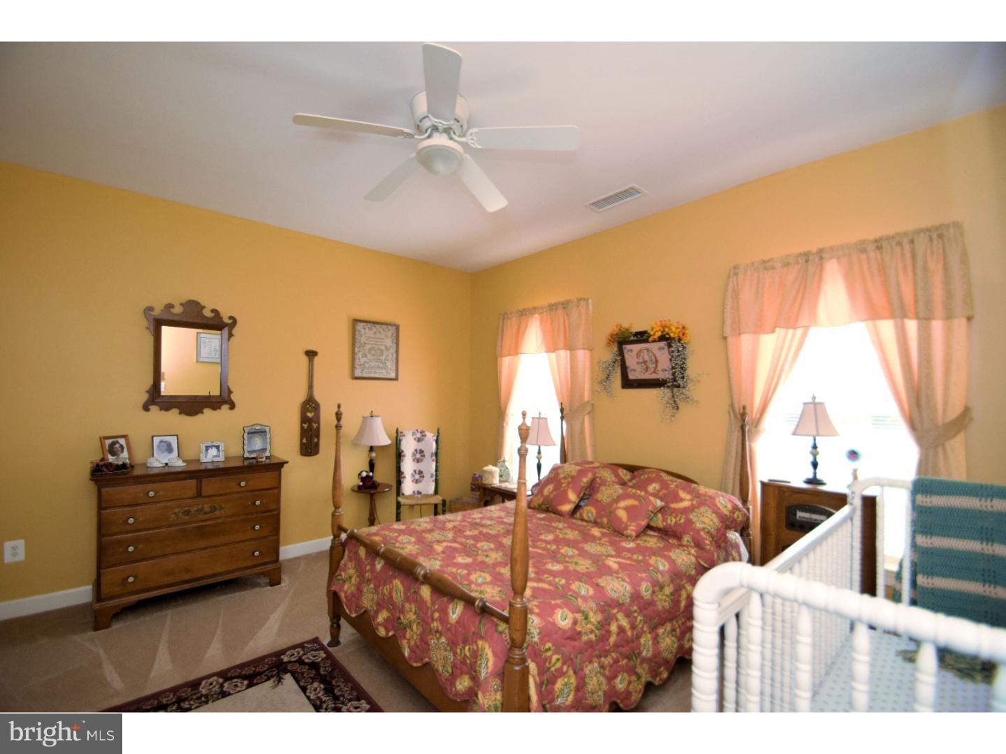 205 Barnhill Road Perkasie, PA 18944 - Photo 19 of 25 a bedroom with a bed and dresser with mirror