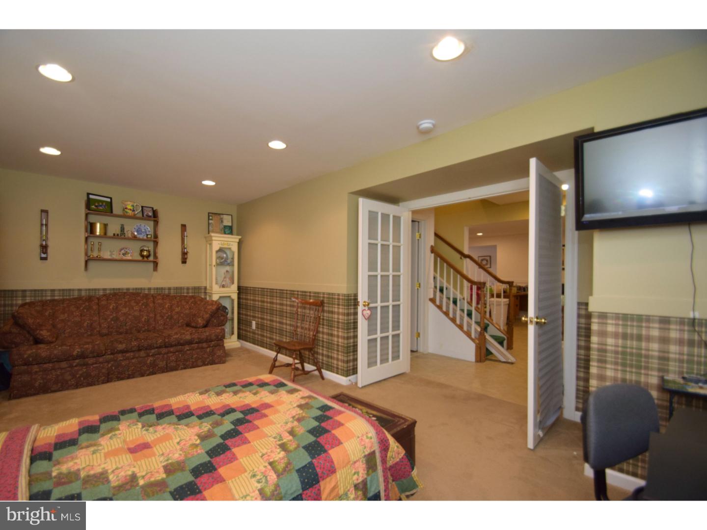 205 Barnhill Road Perkasie, PA 18944 - Photo 23 of 25 a bedroom with a bed and a television