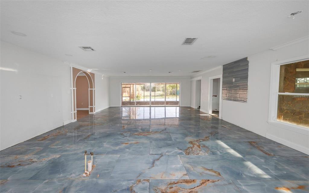 20138 Bowman Road Spring Hill, FL 34610 - Photo 21 of 40 a view of an empty room with a window