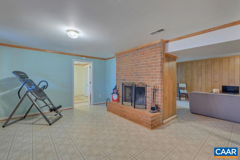 405 Christian Springs Road Amherst, VA 24521 - Photo 35 of 57 a living room with furniture and a fireplace