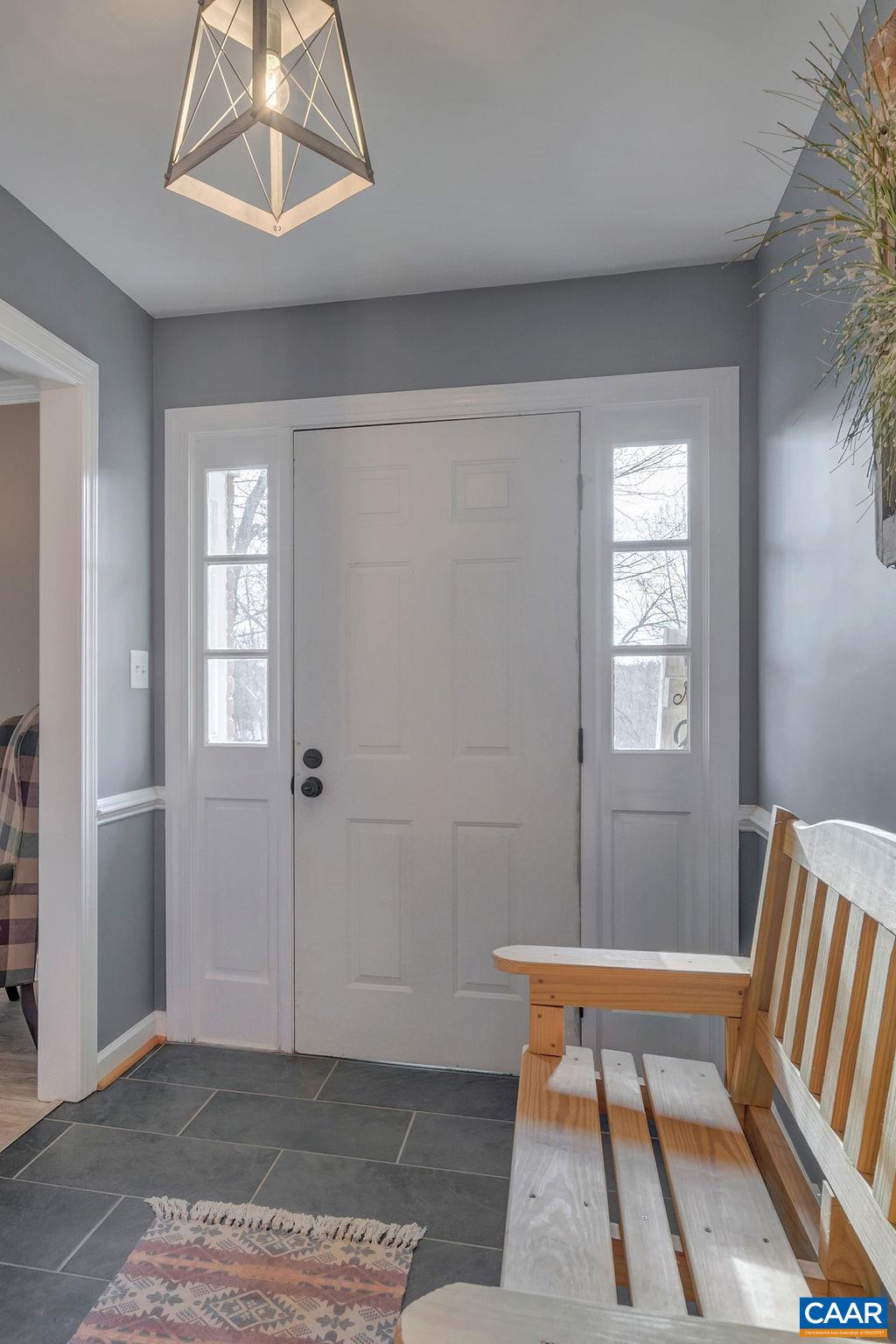 405 Christian Springs Road Amherst, VA 24521 - Photo 7 of 57 a bedroom with a bed and wooden floor