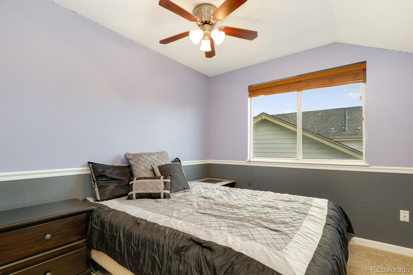 1055 Cobblestone Drive Highlands Ranch, CO 80126 - Photo 16 of 31 a bedroom with a bed and a window