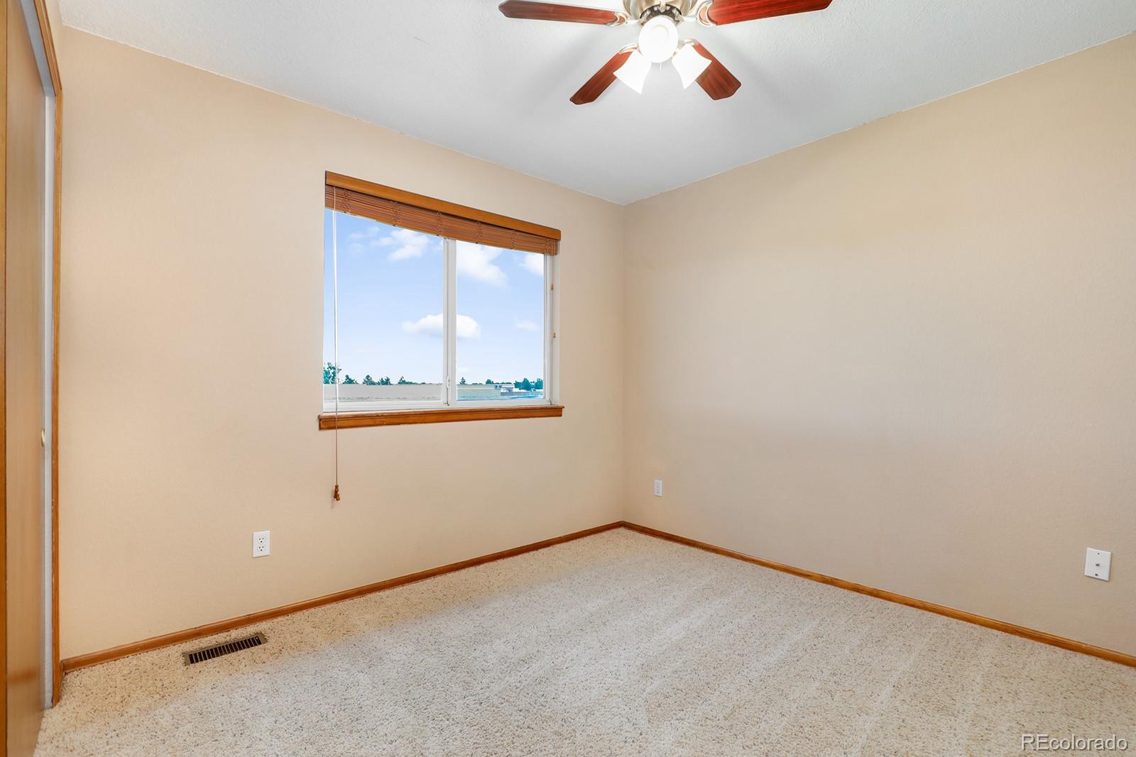 1055 Cobblestone Drive Highlands Ranch, CO 80126 - Photo 18 of 31 an empty room with a window