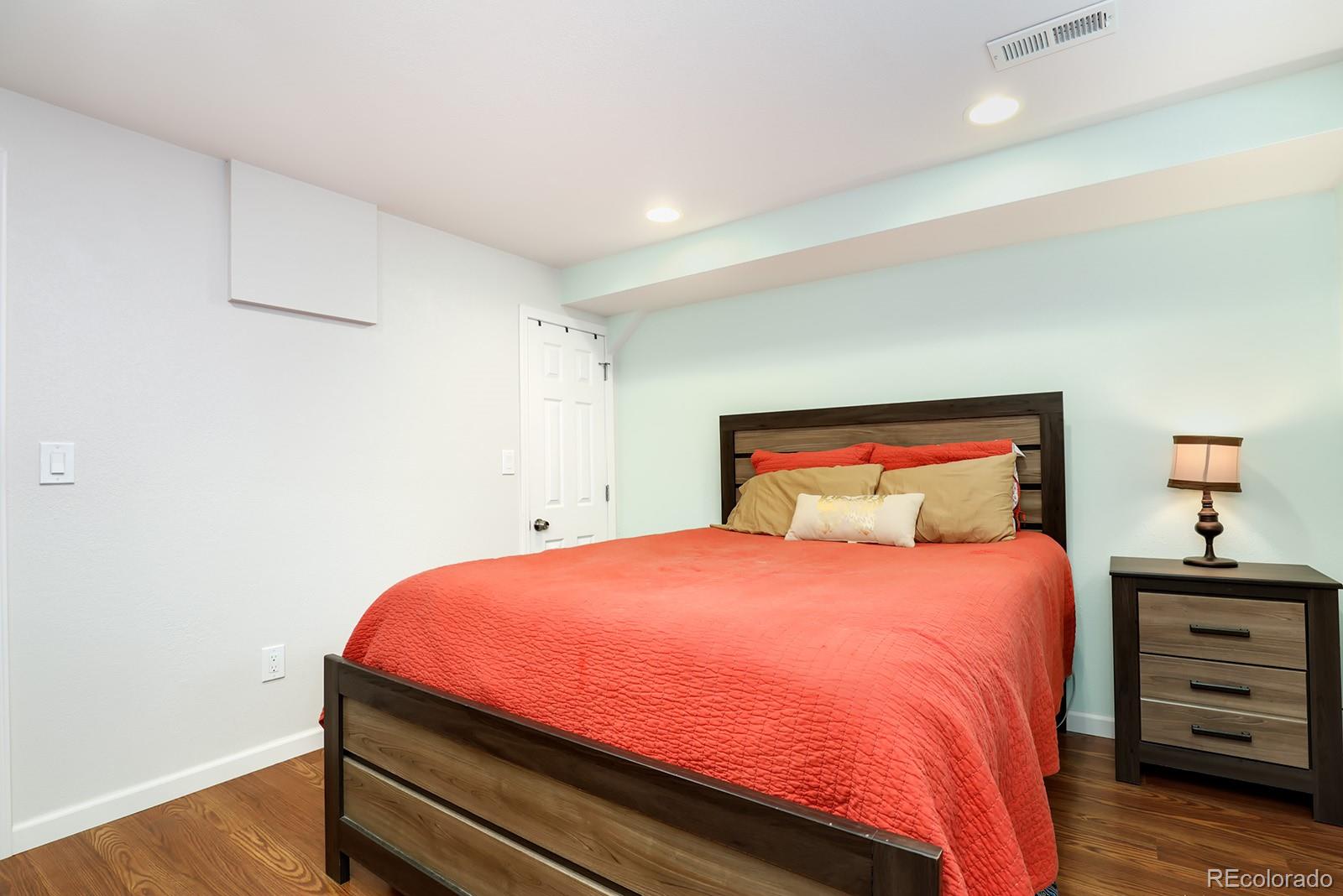 1055 Cobblestone Drive Highlands Ranch, CO 80126 - Photo 25 of 31 a bedroom with a bed and a dresser