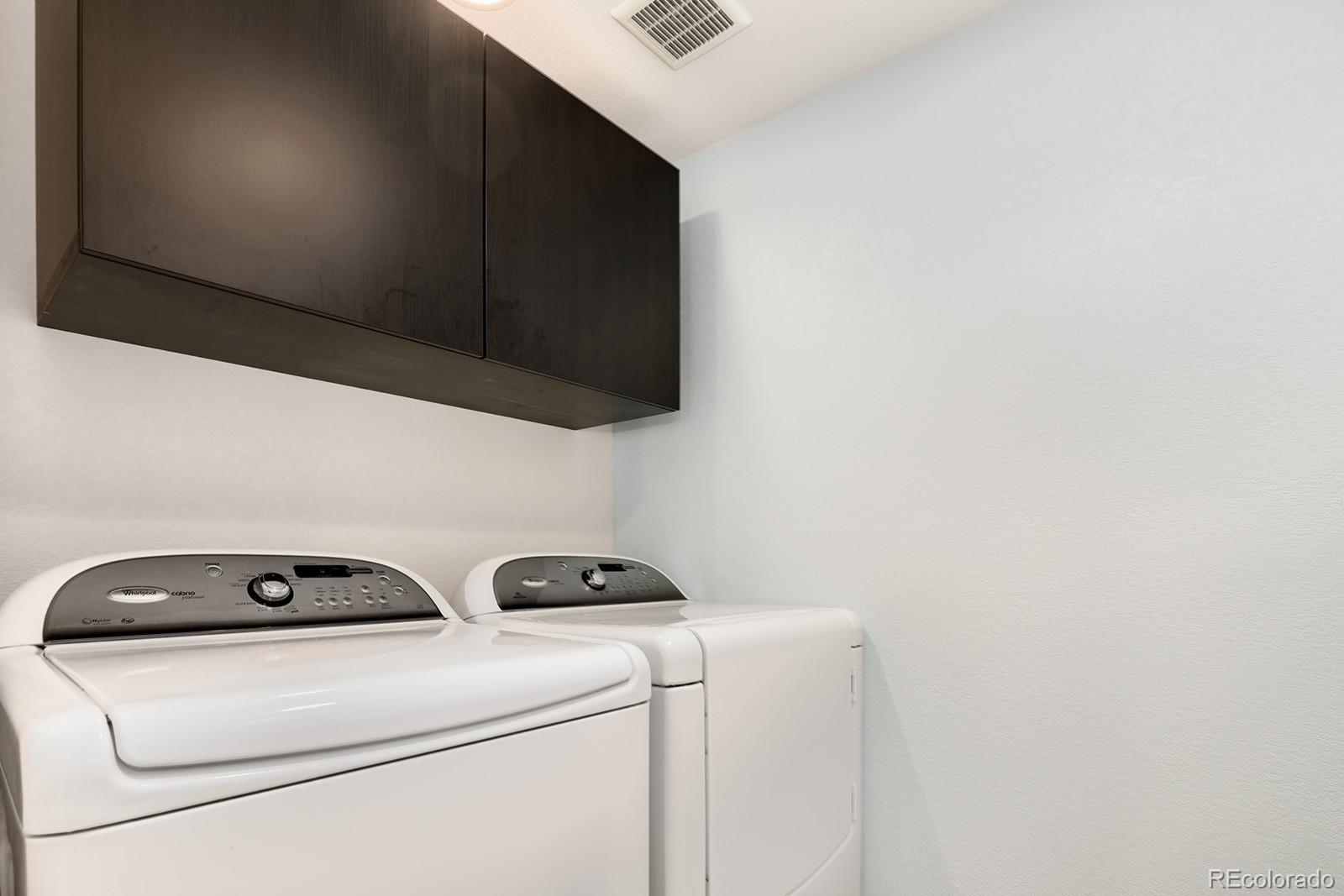 1055 Cobblestone Drive Highlands Ranch, CO 80126 - Photo 27 of 31 a utility room with dryer and washer