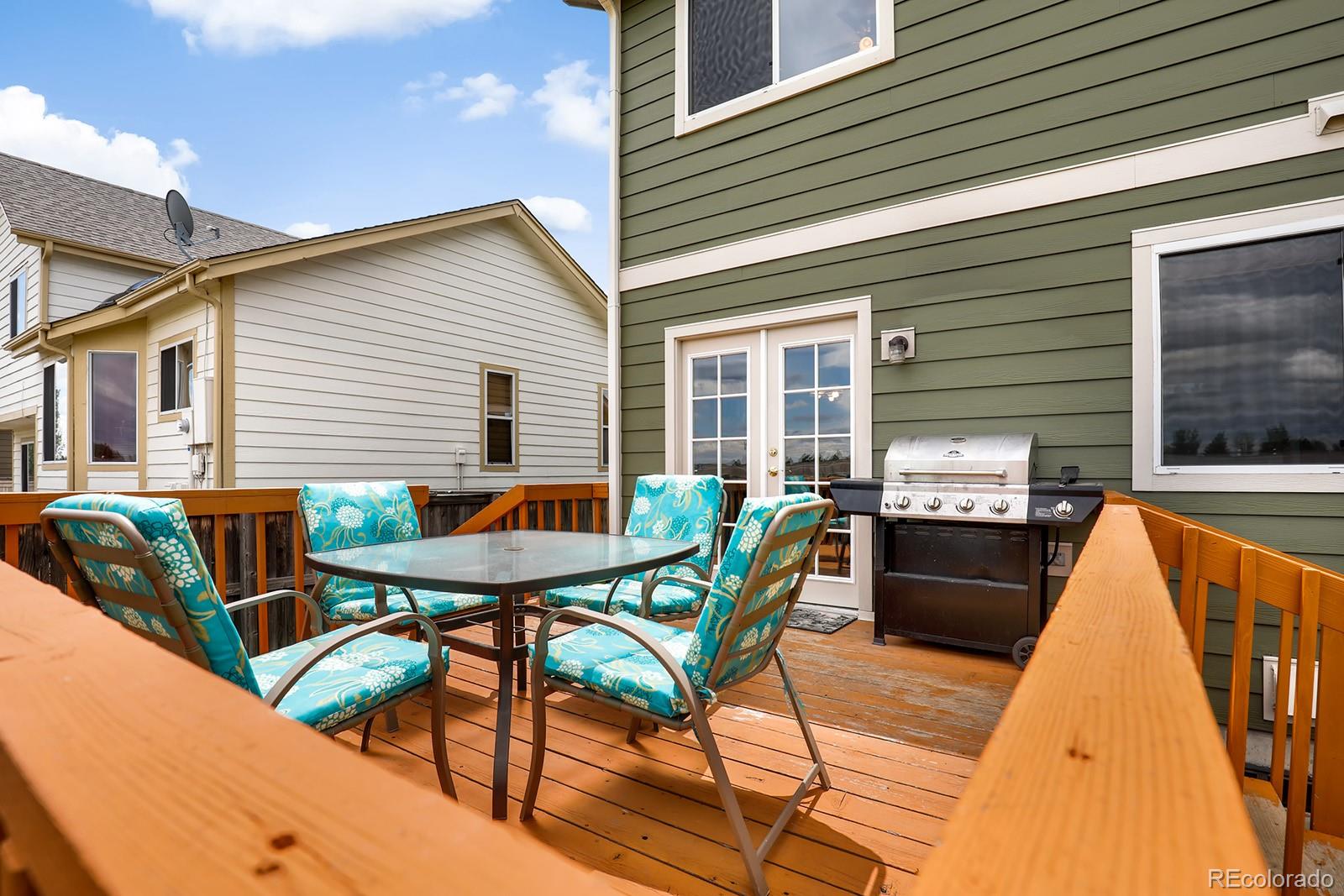 1055 Cobblestone Drive Highlands Ranch, CO 80126 - Photo 31 of 31 a view of a dinning table and chairs in patio
