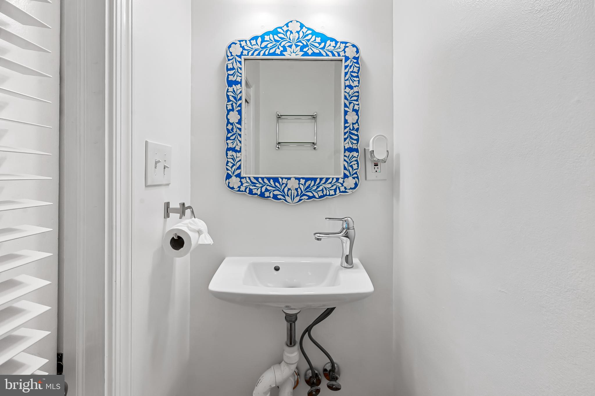 748 Ramsay Street Baltimore, MD 21230 - Photo 11 of 36 a bathroom with a sink and a mirror