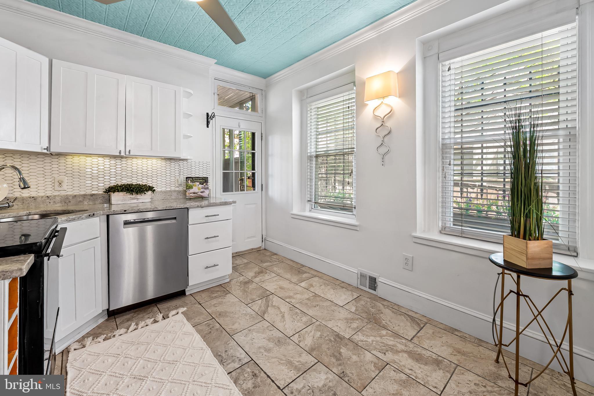 748 Ramsay Street Baltimore, MD 21230 - Photo 16 of 36 a kitchen with a stove a sink and a window