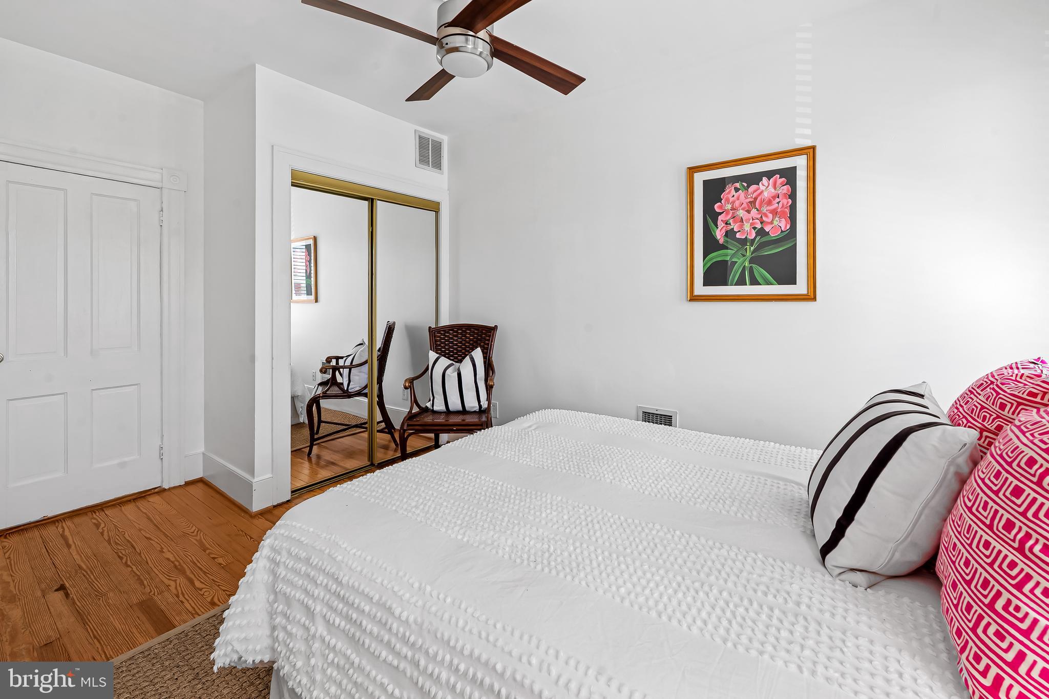 748 Ramsay Street Baltimore, MD 21230 - Photo 24 of 36 a bedroom with a bed and a chandelier