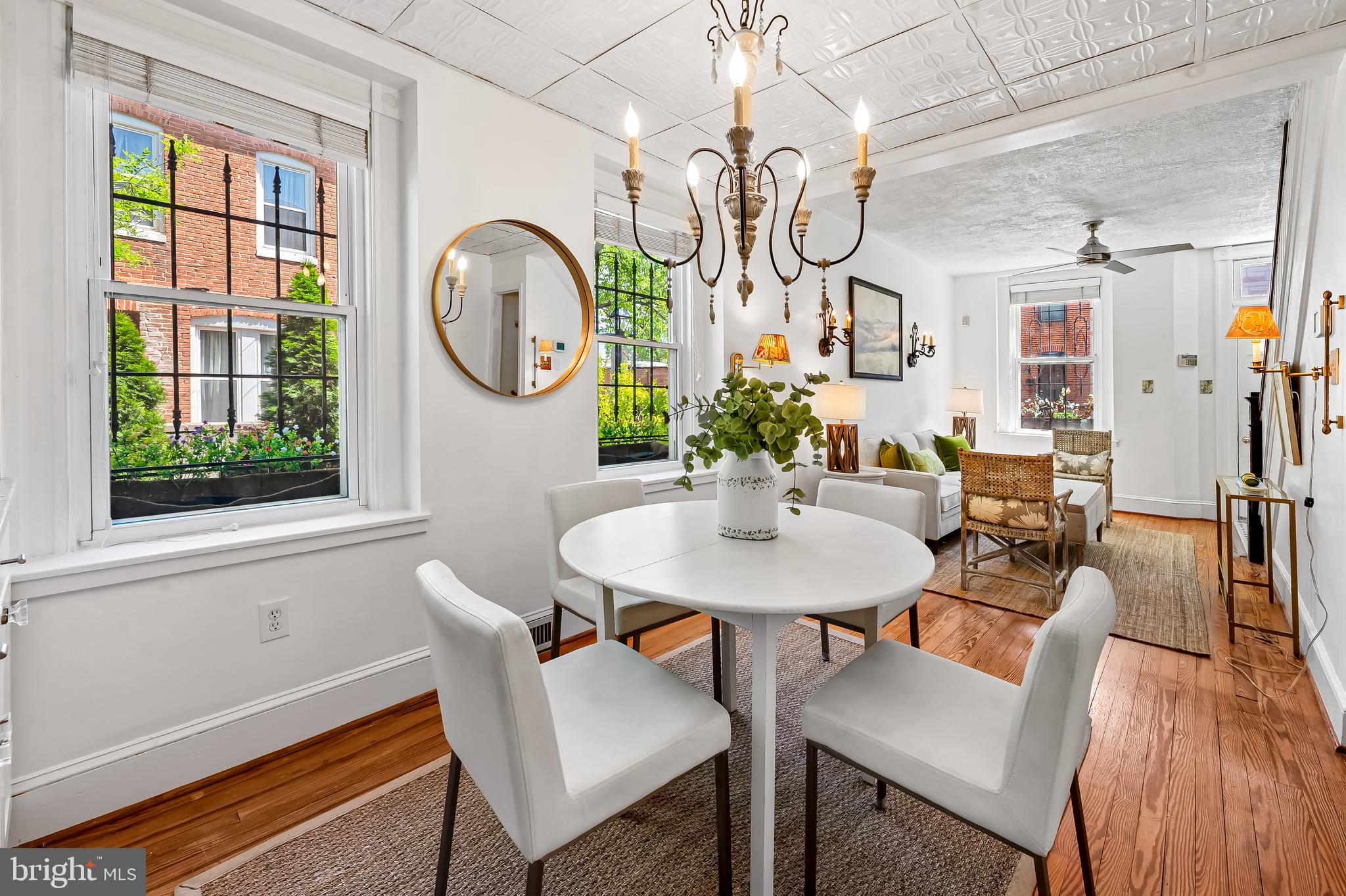 748 Ramsay Street Baltimore, MD 21230 - Photo 9 of 36 a view of a dining room with furniture wooden floor and a window