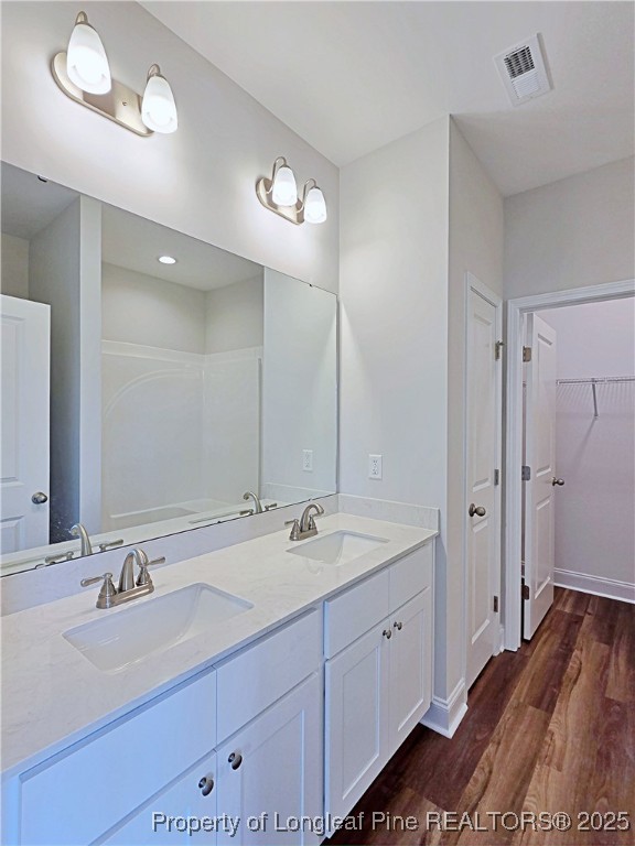 1554 Piney Grove Road Lumberton, NC 28360 - Photo 15 of 27 a spacious bathroom with a double vanity sink a mirror and a shower