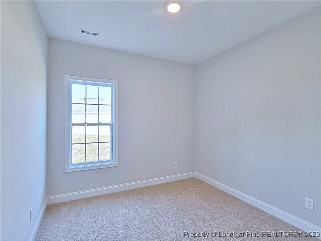 1554 Piney Grove Road Lumberton, NC 28360 - Photo 18 of 27 an empty room with a window