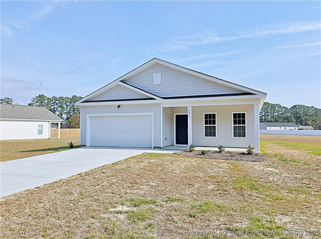 1554 Piney Grove Road Lumberton, NC 28360 - Photo 25 of 27 a view of a house with a yard