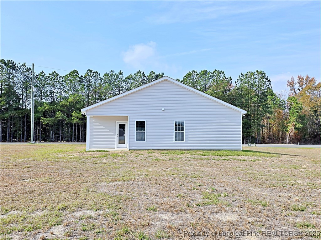 1554 Piney Grove Road Lumberton, NC 28360 - Photo 26 of 27 a house with trees in the background