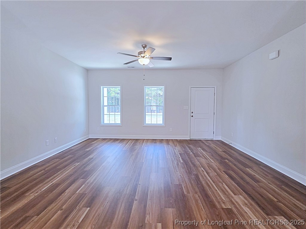 1554 Piney Grove Road Lumberton, NC 28360 - Photo 3 of 27 wooden floor in an empty room with a window