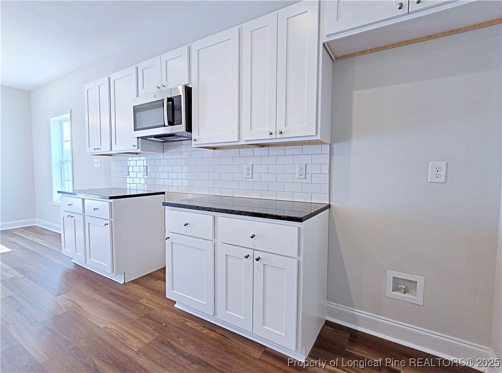 1554 Piney Grove Road Lumberton, NC 28360 - Photo 7 of 27 a kitchen with white cabinets stainless steel appliances and sink