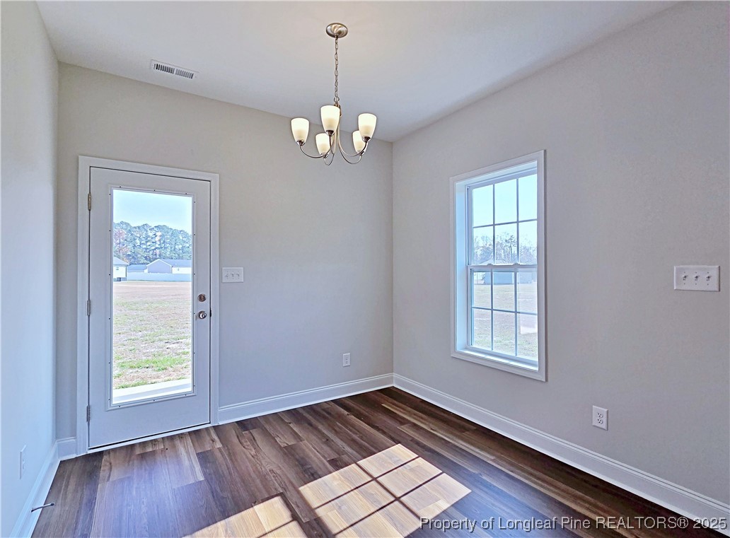 1554 Piney Grove Road Lumberton, NC 28360 - Photo 10 of 27 a view of empty room with wooden floor and window
