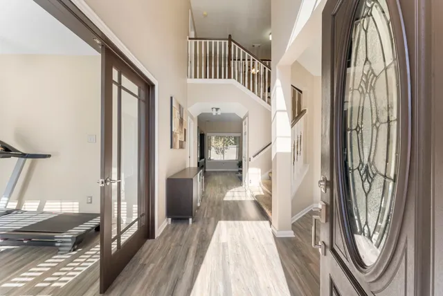 a view of a bedroom from a corridor