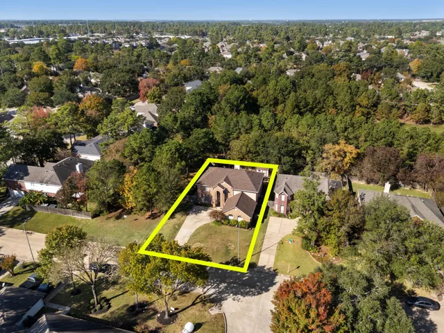 an aerial view of a house with a garden