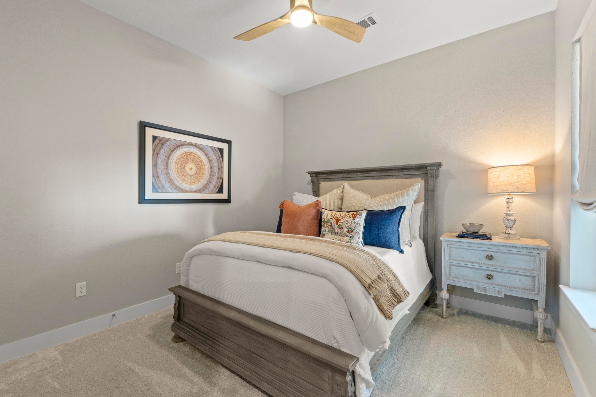 4501 Jackson Avenue, Unit 5302 Austin, TX 78731 - Photo 13 of 38 a bedroom with a bed and a chandelier