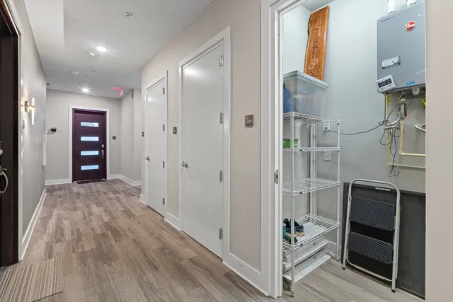 a view of empty room with wooden floor