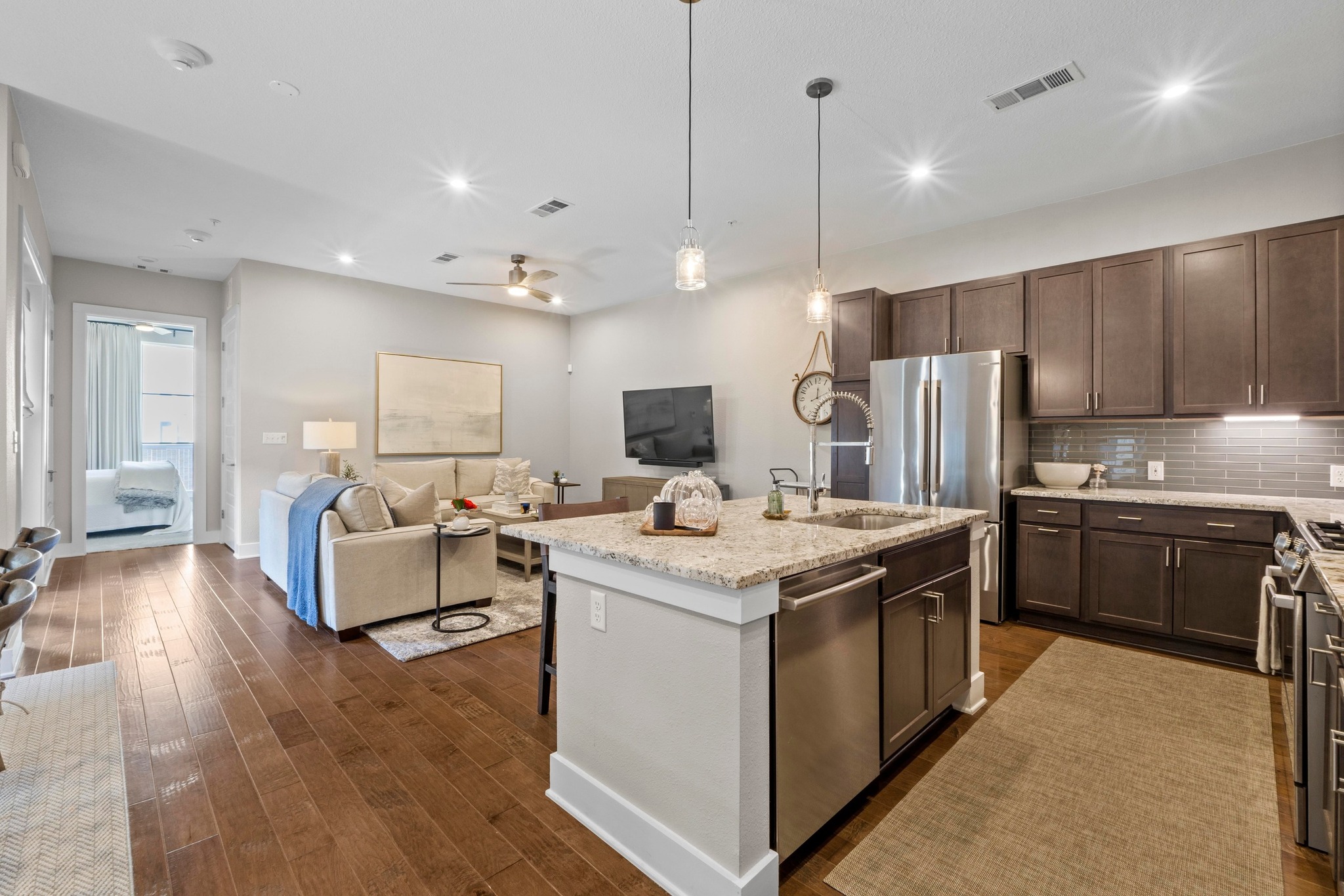 4501 Jackson Avenue, Unit 5302 Austin, TX 78731 - Photo 2 of 38 a kitchen with a stove a refrigerator and a microwave