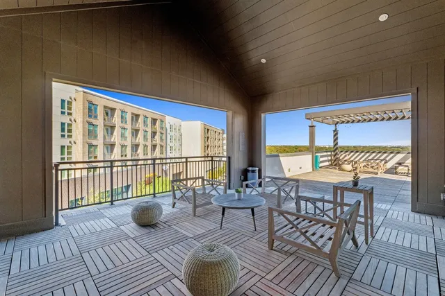 a view of a balcony with dining area