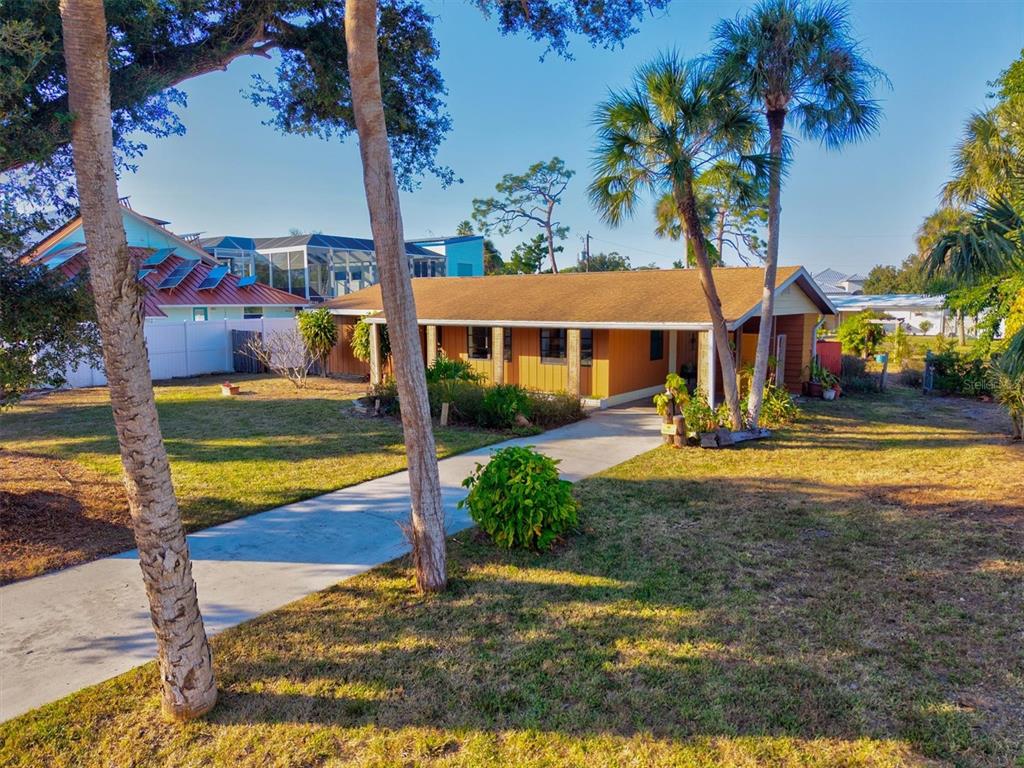 148 Roberts Road Nokomis, FL 34275 - Photo 11 of 68 a view of outdoor space yard and front view of a house