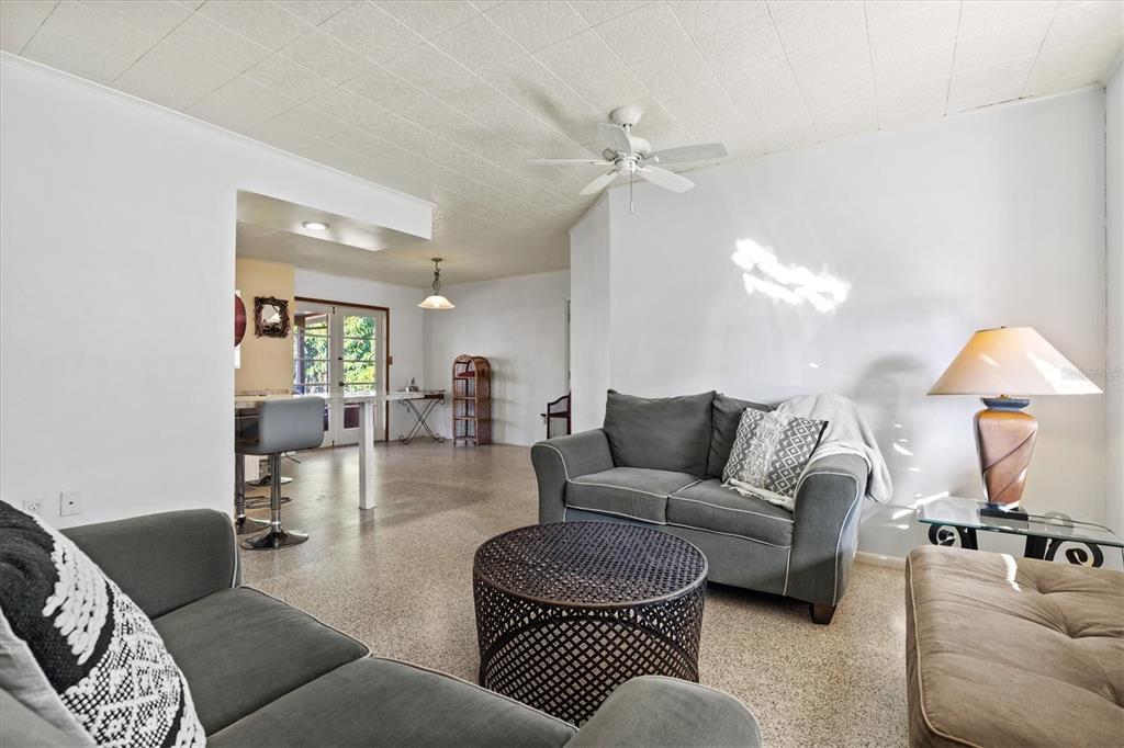 148 Roberts Road Nokomis, FL 34275 - Photo 12 of 68 a living room with furniture and a lamp