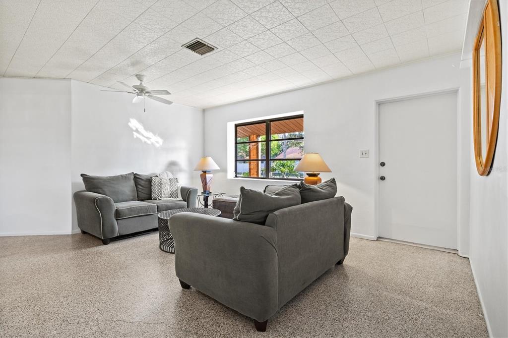 148 Roberts Road Nokomis, FL 34275 - Photo 14 of 68 a living room with furniture and a window