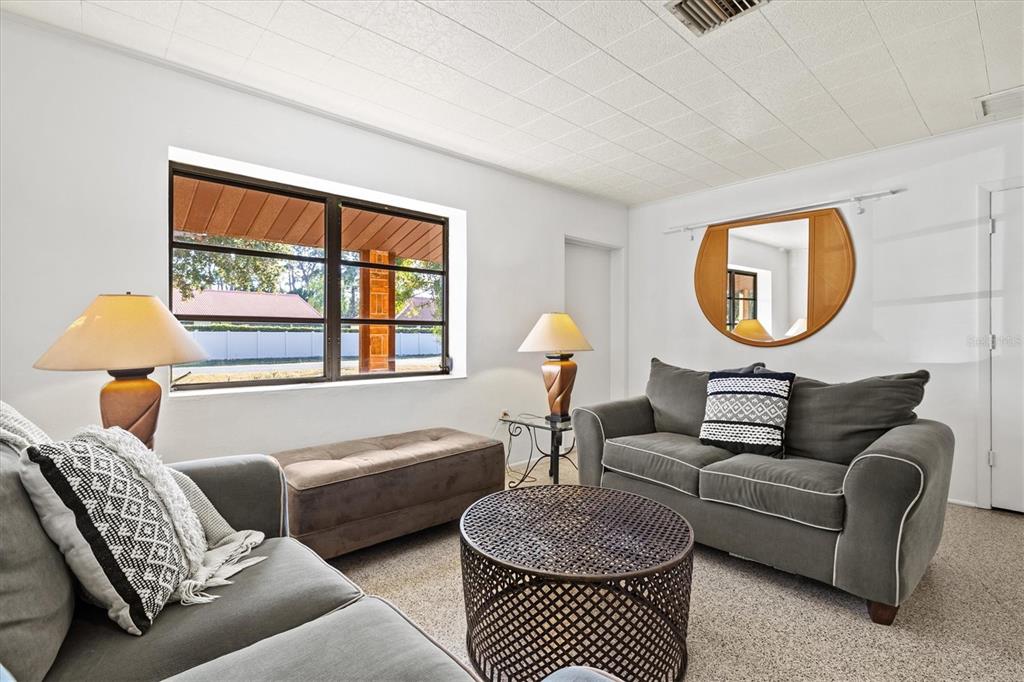 148 Roberts Road Nokomis, FL 34275 - Photo 15 of 68 a living room with furniture and a window