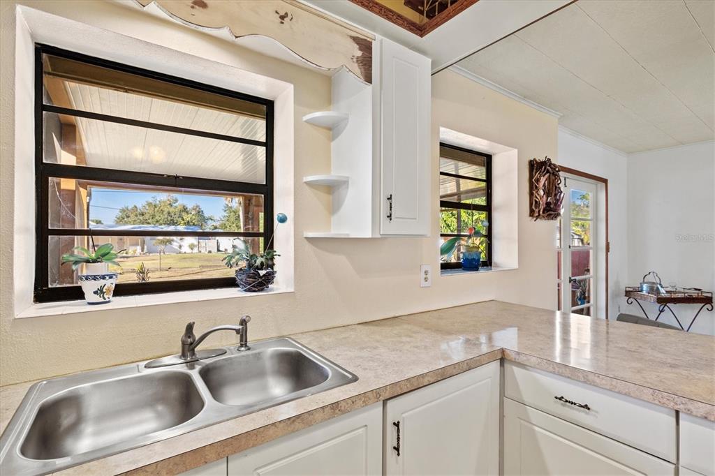 148 Roberts Road Nokomis, FL 34275 - Photo 19 of 68 a kitchen with a sink and a window